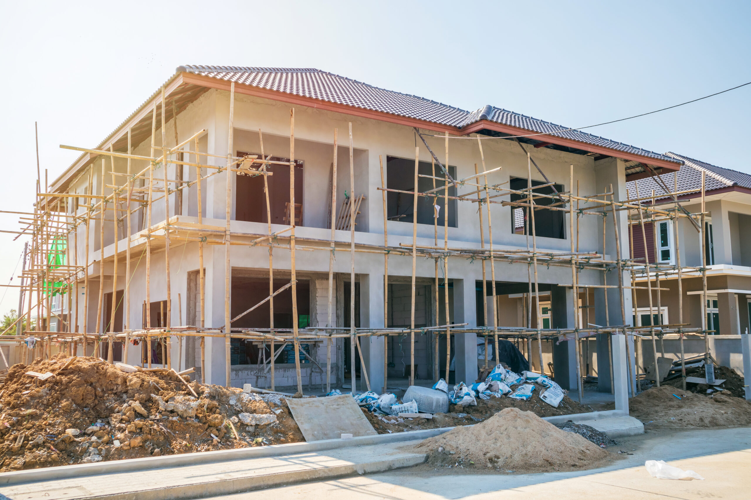 New residential house contemporary style building in progress at New residential house contemporary style building in progress at construction site with blue sky
